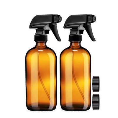 China Cosmetic 16 Oz Clear Amber Round Glass Spray Bottle Silicone Sleeve With Trigger Spray Top for sale