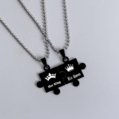 China TRENDY 2Pcs/Set Creative Love Puzzle Necklace Her King His Queen Crown Couple Hollow Pendant Necklace Gold Black Jewelry for sale