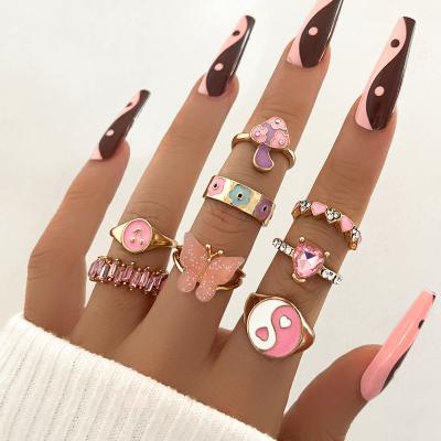 China Nickel-Free Lead-Free European Fashion 8pcs/set Pink Oil Dripping Heart Flower Shape Rings Paved Pink Cubic Zirconia Butterfly Rings For Women for sale