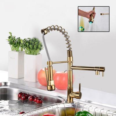 China Double Swivel Spout Gold Spring Kitchen Faucet Pull Down Double Outlet Springs Hand Held 360 Swivel Shower Kitchen Mixer Crane Hot Cold Taps for sale