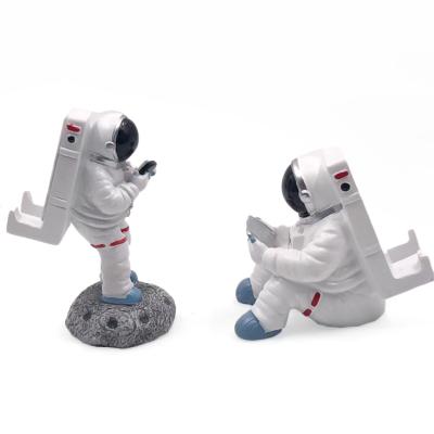 China Creative Waterproof Mobile Phone Holder Resin Astronaut Household Goods Crafts for sale