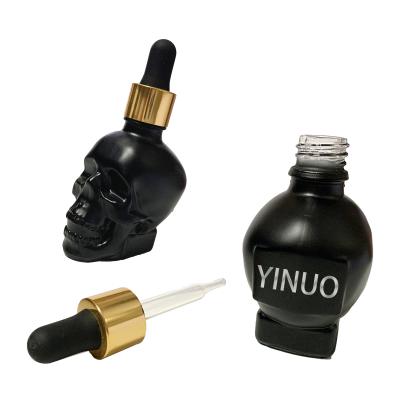 China Personal Care Hot Selling New Design Skull Shape Glass Bottles For Perfume Dropper Bottle en venta