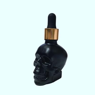 Chine Luxury high quality personal care skull shape glass dropper bottles with cheap price à vendre