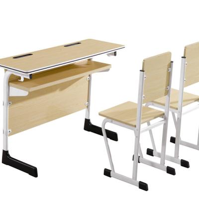 China Modern Workmanship and Metal Frame Double Metal School Furniture Classroom Wooden Table and Chair Set for sale