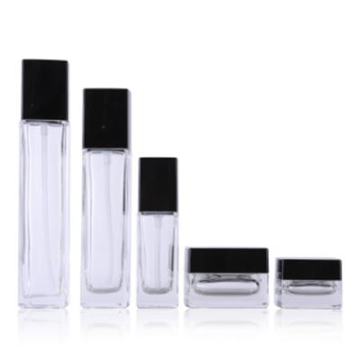 China 20g 50g 40ml 100ml 120ml Square Cosmetic Luxury Empty Black Cover Spray Pump Set Face Lotion Cream Glass Bottle Jar Cosmetic Package for sale