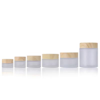 China Wholesale 5g 15g 30g 50g 100g Eco Glass Cosmetic Containers Matte Beauty Gel Jar Frosted Cream Jar With Bamboo Lid for sale