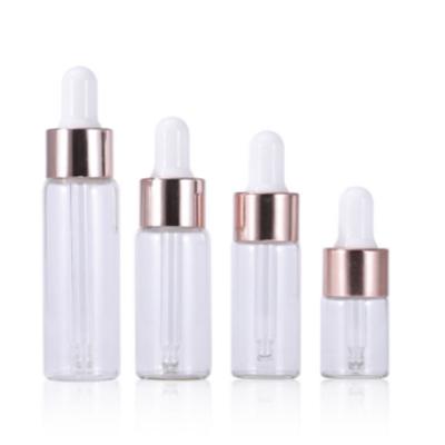 China Cosmetic Bottle 5ml 10ml 15ml 20ml Cosmetic Glass Dropper Rose Small Gold Dropper Bottle Oil Dropper Bottle for sale