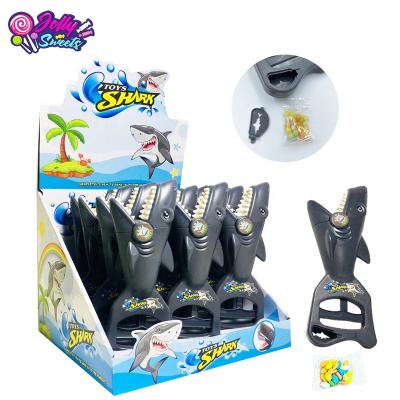 China Cartoon Toys Plastic Hand Shark JollySweets Candy Toy Grabber Model Toy with Candy for Kids ABS Material High Quality Plastic for sale