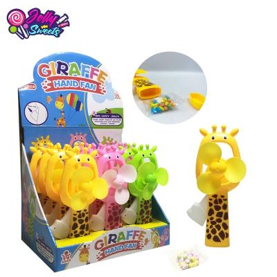 China Cartoon Toys Lovely JollySweets Giraffe Figure Hand Driven To Fan Plastic Toys With Candy for sale