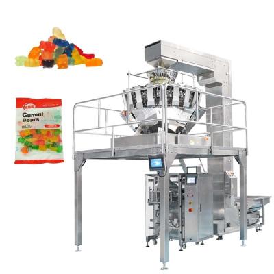 China Automatic Food Weigh Caramel Gummy Bear Candy Fondant Lollipop Soft Packaging Machine for sale