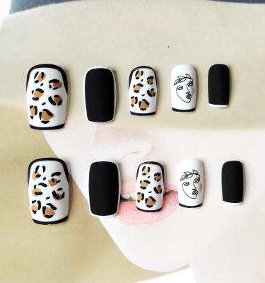 China Popular Design Matte Manicure Long Square Black Leopard Print Humanface Art Press On Nails Fake Nails In Artificial Nails for sale