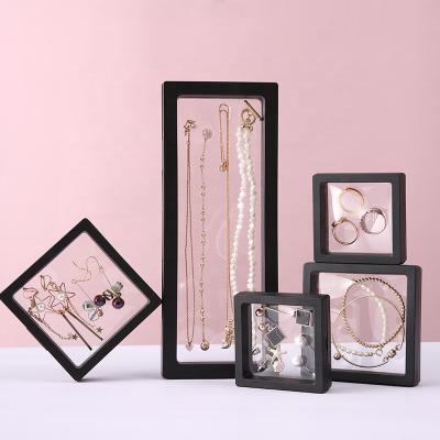 China Transparent Floating Jewelry Storge Box 3D Display Stand Rack Holders Ring Bracelet Coin Suspended Black Gift Packaging Box for sale