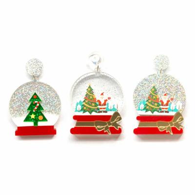 China Cute Cute Christmas Holiday Sparkle Christmas Tree Crystal Ball And Santa Snow Globe With Bowtie Acrylic Stud Earrings For Women for sale