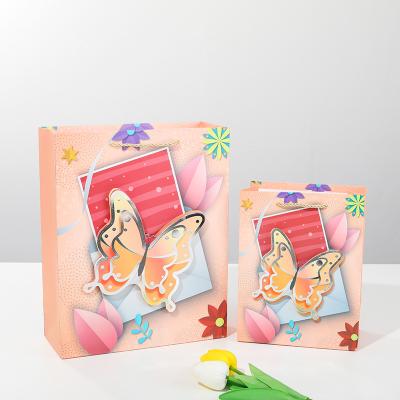 China Recycled Materials competitive price shopping paper bags food thank you de papel with your own logo Cartoon dinosaur boy Easter butterfly for sale