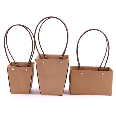 China Recyclable Custom Waterproof Flower Bag Mini Kraft Paper Flower Packaging Basket Bag for sale