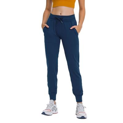 China Breathable Women's Joggers Sporty Pants Comfortable Drawstring Workout Lounge Pants Yoga Sweatpants With Pockets Fashion Sports Wear for sale