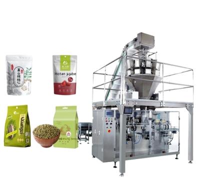 China Food Horizontal pellet bag feeding machine Nut biscuit candy food zipper self-supporting bag prefabricated bag packing machine for sale