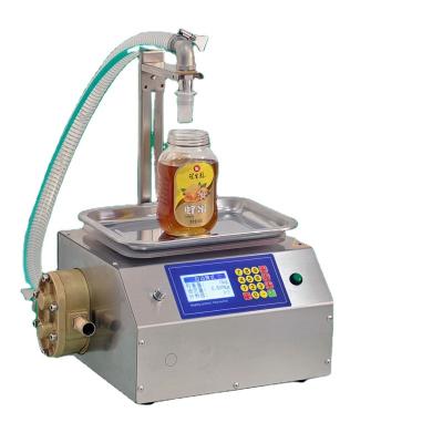 China Food Smart automatic bee honey filling machine liquid white emulsion oil  Cream honey jar filling machine for sale