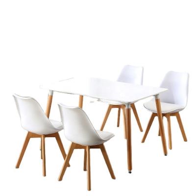 China Nordic White MDF Table Wood Legs Restaurant With MDF Wood Table And Strong Plastic 4 6 8 Kitchen Dining Chairs Set for sale