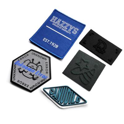 China Popular Design Punching Embossed Gold Stamp Oiled Edged Leather 3D Iron-On Silicone Laser Engraving Clothing Patch for sale