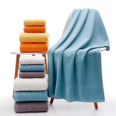 China Compressed Pure Color 70*140 Large Towel 100% Cottonlarge Bath Towel For Hotel for sale