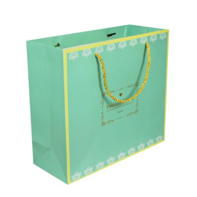 China Factory Recyclable Eco-friendly Luxury Gold Foil Green China Kraft Paper Shopping Bag For Clothing for sale