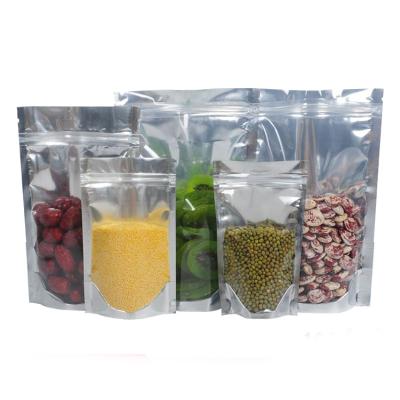 China One Side Moisture Proof Wholesale Stock Clear Foil Stand Up Candy Packaging Zipper Pouch Bag Beans And Bag 30x40x6cm for sale