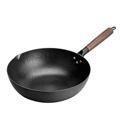 China Viable Fish Scale Shape Hand Hammered Black Steel Wok Pan With Beech Wooden Handle for sale