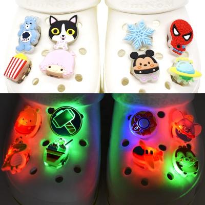 China Clog Charm 2022 Wholesale New LED Light Up Cool Sparkle Shoe Charms For Kids PVC Sandal Clogs Croc Charms for sale