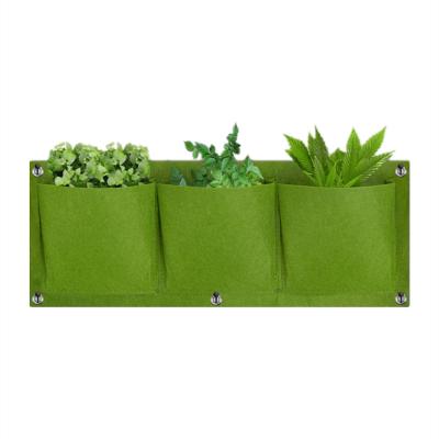 China Grow Plants Hanging Garden Black Planter Grow Bag 3 Pockets Vertical Garden Felt Planting Grow Bags for sale