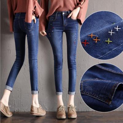 China LM5379Q Breathable High Rise Holes European Jeans Big Size Denim Pants Pencils Jeans for sale