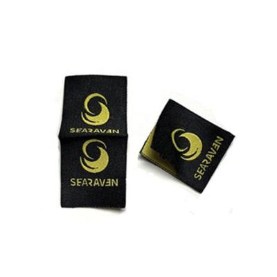 China Sustainable custom own logo center fold garment apparel clothing t-shirt woven clothes hem label for beanies hat for sale