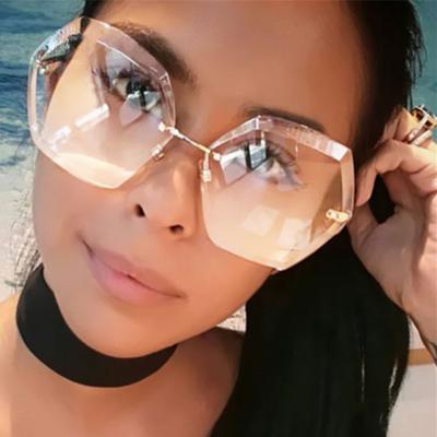 China Lady Feminine Rimless Sunglasses For Unique Irregular Oversized Women Sun Glasses Fashion Sun Shades Outdoor Glass for sale