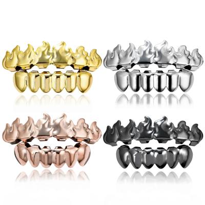 China Nickel Free Lead Free Hip Hops Jewelry Real Gold Plated Flame Teeth Grillz Top Vampire Fangs Lower Teeth Grills Set For Men for sale