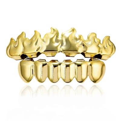 China Nickel Free Lead Free Hip Hops Jewelry Real Gold Plated Flame Teeth Grillz Top Vampire Fangs Lower Teeth Grills Set For Men for sale