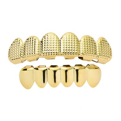 China Nickel Free Lead Free Hot Selling 18K Gold Punk Plated Vampire Fangs Upper Lower Teeth Grillz Set Lattice Texture Teeth Grillz For Men for sale