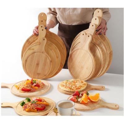 China Sustainable Restaurant Home Round Wooden Pizza Dishes With Handle for sale