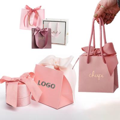 China Durable Custom Luxury Small Cardboard Jewelry Gift Pouch Jewelry Box Packaging Pink Pink Shopping Paper Bag With Ribbon Handle for sale