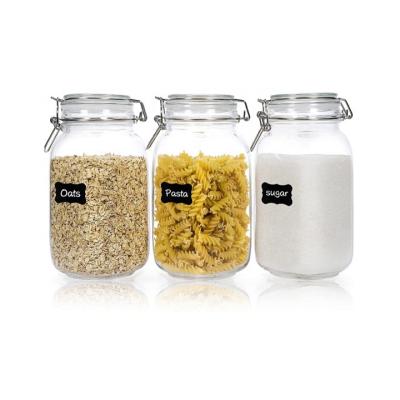 China Freshness Keeping Square Kitchen Storage Canister Glass Jars With Clear Lid And Stainless Steel Buckle for sale