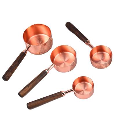 China Walnut Sustainable Handle 430 Stainless Steel Rose Gold Color Measuring Cup And Spoon Set for sale