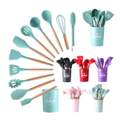 China Stocked 12 Piece Kitchen Accessories Non Stick Spoon Spatula Shovel Dish Tools Silicone Cookware Set with Wooden Handles for sale