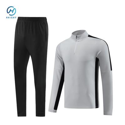 China Winter Men Running Sports Clothing Football Kit with Automated Cutting Technology for sale