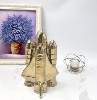 China Europe hot sale space creative style on gold color luxury home decoration rocket glazed ceramic sculpture for sale