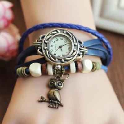 China Auto Date Bracelets For Women Jewelry Promotional Gift With Leather Watch Owl Pendant Weave Wrap Watches Women Quartz Watch for sale