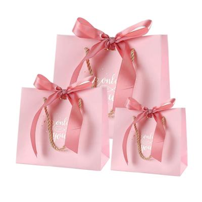 China Recyclable Custom White Fashion Recyclable Logo Printing Luxury Small Pink Retail Gift Shopping Paper Bags With Ribbon Handle for sale