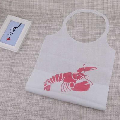 China Custom Comfortable Adult Disposable Bibs Printing Non-woven Disposable Logo Kitchen Use Crab Aprons Apron For Restaurant And Seafood for sale