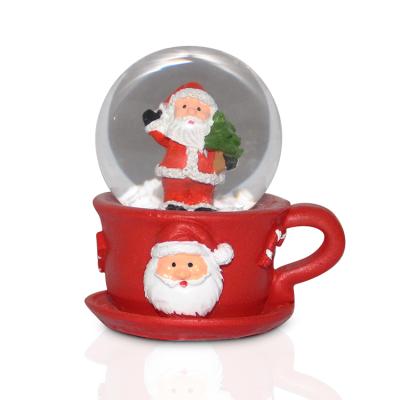 China Cheap Customized Traditional 45mm Christmas Bag Snow Globe Santa Claus Snow Globe for sale