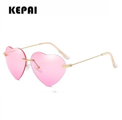 China Fashion Sunglasses New Fashion Luxury OEM Custom Colors And Logo Heart Shape Rimless Sunglasses Women for sale