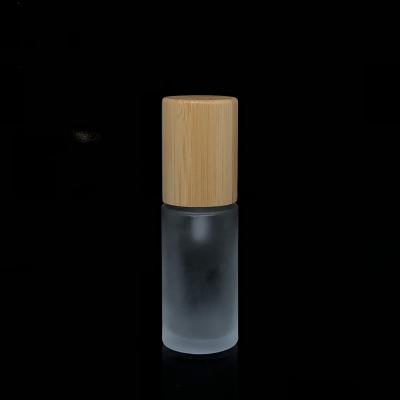 China Eco-friendly Promotion 40g Pump Bottles Glass Organic Empty Glass Cream Bottle With Bamboo Lid For Lotion for sale