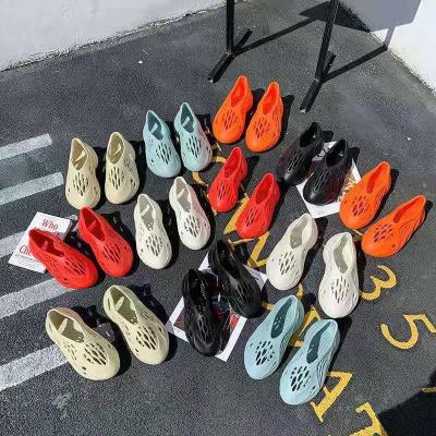 China 2022 Fashion Trend Summer Shoes Couples Solid Unisex Lightweight Beach Wear Holes Comfortable Flat Sandals for sale